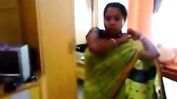 Bhabhi changing her blouse and peticot in bedroom which hubby is filming her and asking her to give some sexy poses.