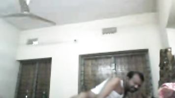 Desi couple from Meherpur showing big boobs while getting her tight clean shaven cunt fucked by horny husband in missionary position in this MMS.