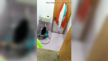 My cousin getting pee in washroom