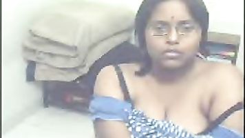 Maya aunty from Ahmedabad captured live on webcam getting naked showing her assets.